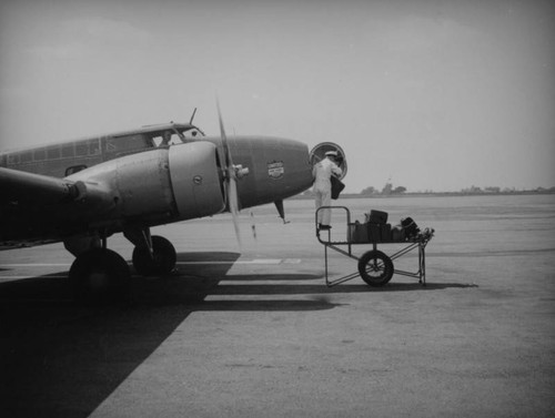 Loading luggage onto a Boeing 247