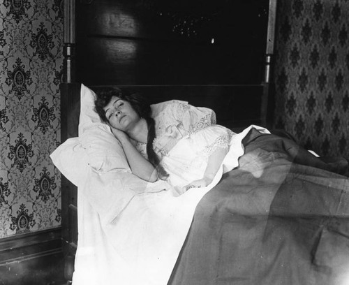 Woman lying in bed