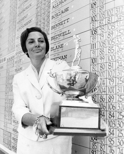 Betty Lovey displays trophy