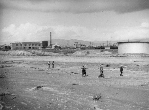 Workers and collapsed tracks, L.A.River flooding