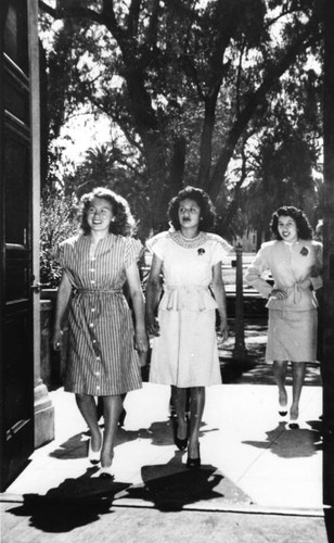 American Indian women entering building