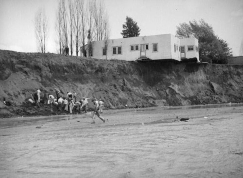 L.A. River flooding, escavation on the riverbank in North Hollywood