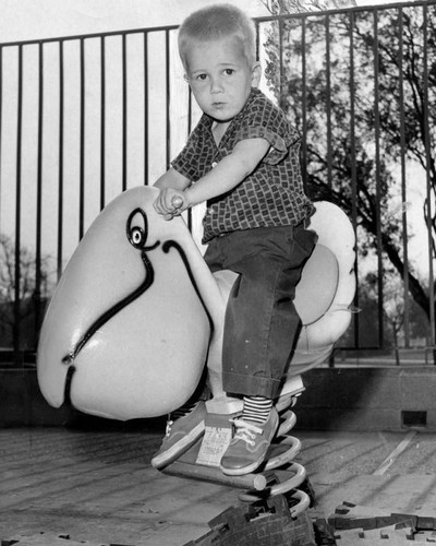 Three year-old has fun on the playground