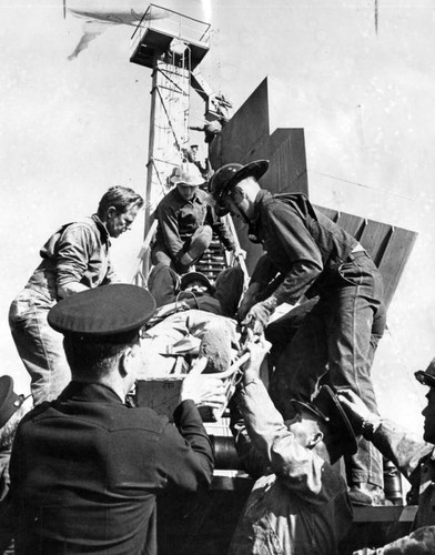 Firemen carry injured man down from Sun Valley tower where he fell 25 feet