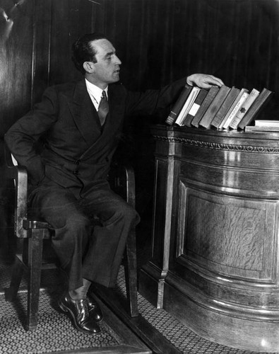 Harold Lloyd selecting a book