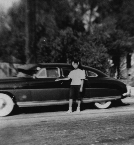 Mexican American woman with car