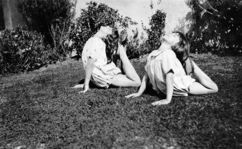 Sisters playing in yard