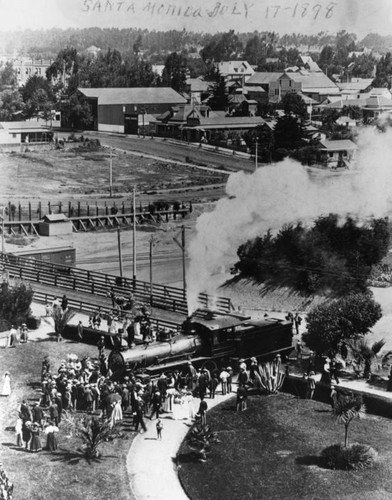 Crowd gathers around locomotive