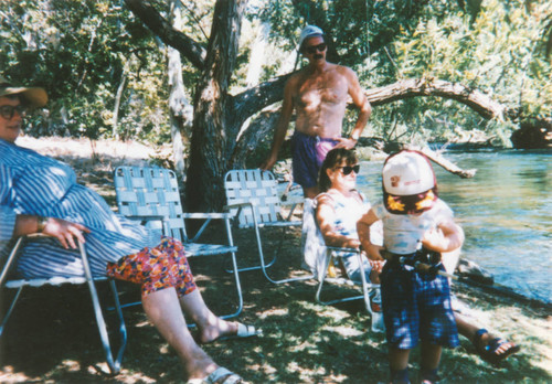 Family camping near river