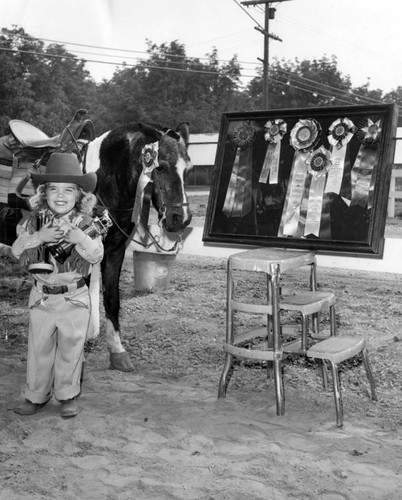 Valleys tiniest cowgirl limbers up pony for Santa Barbara Spanish Day Fiesta