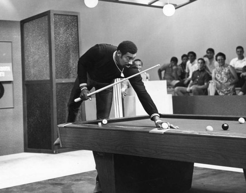 Chamberlain shooting pool