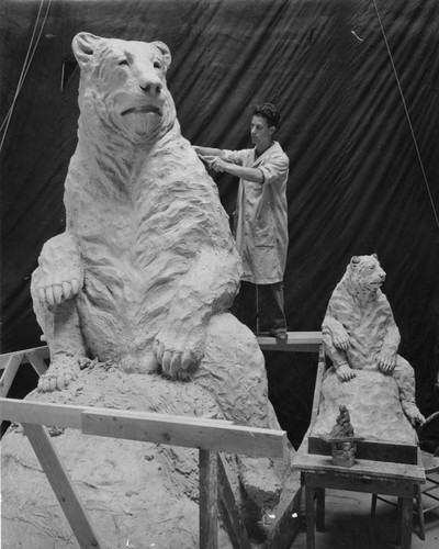 Sculptor finishing short-faced bear statue