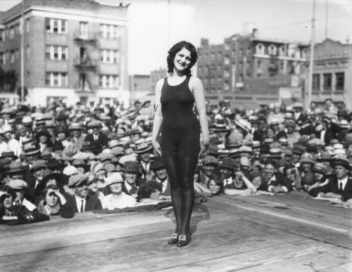 Beauty contest finalist poses on stage