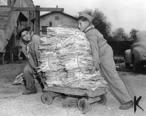 Scouts moving bundles for paper drive