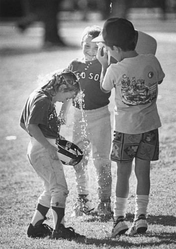 Little leaguers cooling off after a game