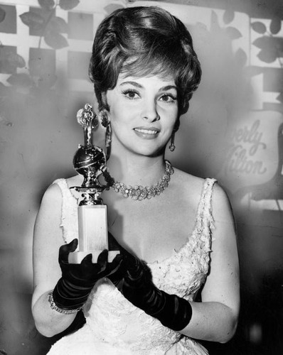 Gina Lollobrigida holds trophy