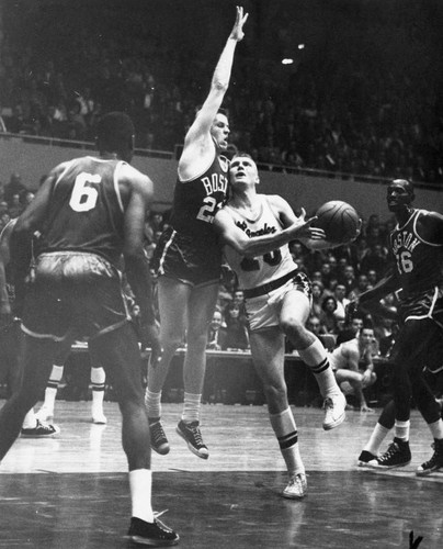 Lakers' Don Nelson attempts layup through defense of Frank Ramsey (23)