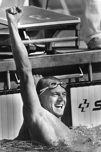 Rowdy Gaines raises a fist in celebration