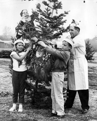 Man-of-the-month sells YMCA trees