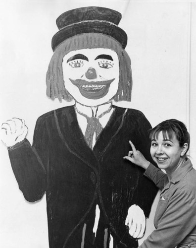 Actress Jane Withers admires husband's clown