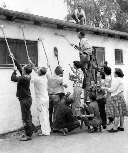 Parents wield brush for therapy clinic