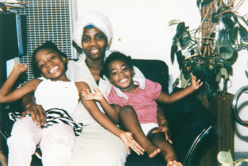 Verona Jemmott Burks with daughters at home