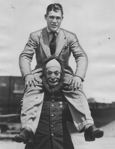 Glen Lee poses with a clown