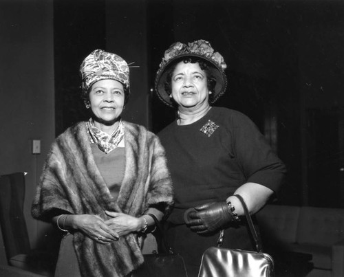 Two hat-wearing women