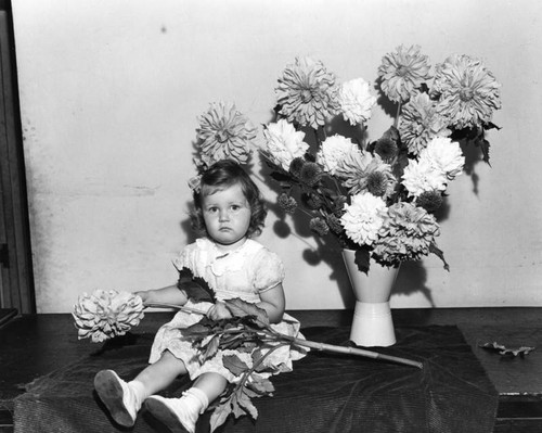 Girl with large dahlias