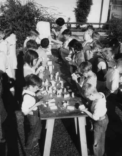 Children learning soap sculpture, view 3