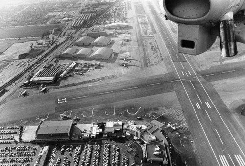 Hangers, airplanes line runways of Lockheed Air Terminal, Burbank