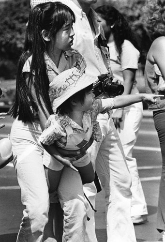 Two young cousins watch the Nisei Week Parade