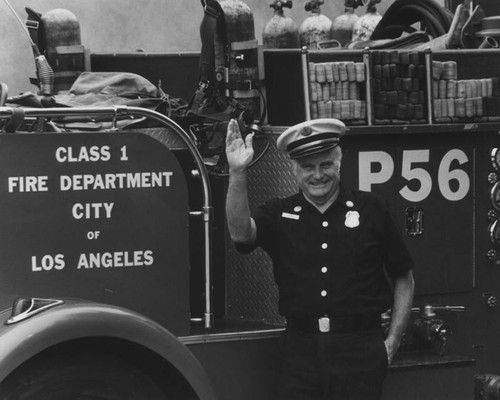 Fire Dept. officer waving