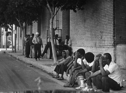 Street people line up at homeless shelter