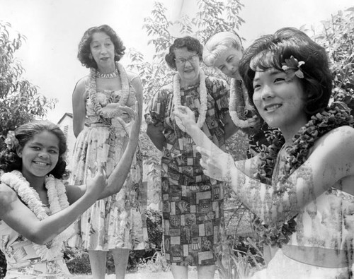 Young dancers, Darryl Ann Wade, left, and Jeanne Tanaka demonstrate hula