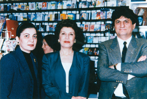 Two women and a man in Persian bookstore