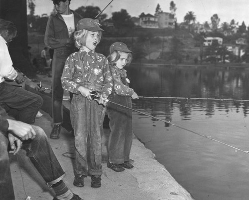 Young sisters fishing in Echo Park lake