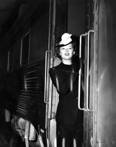 Myrna Loy leaving on train