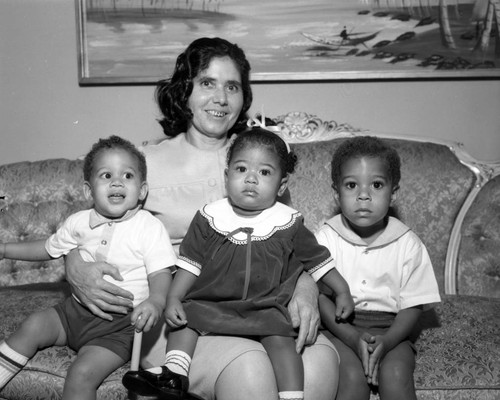 Unidentified woman and children