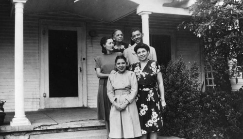 Family in front of home