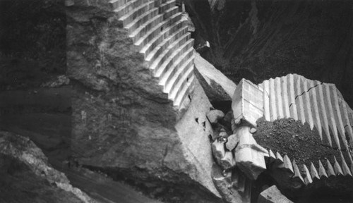 Sightseers climb large chunks of concrete, St. Francis Dam