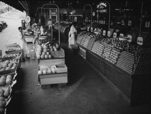 Shopping at Hollywood Market's fruit stand