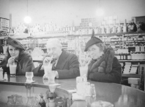 Ethel Schultheis and parents drinking malts at Thrifty Drug