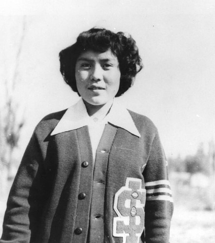 American Indian girl in Sherman Institute school sweater