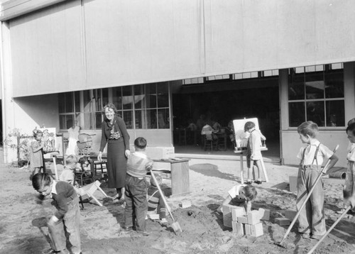 Teacher and her students, Corona Avenue School