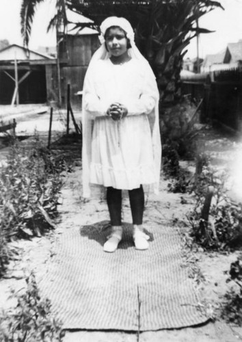 Girl in first communion dress