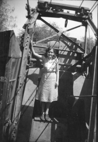 Girl standing on equipment