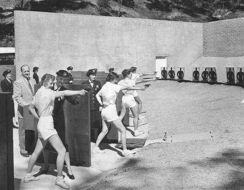 Policewomen practice marksmanship