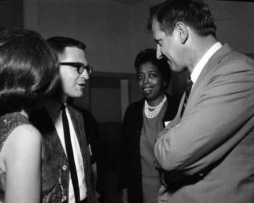 Charles Warren with unidentified man and women