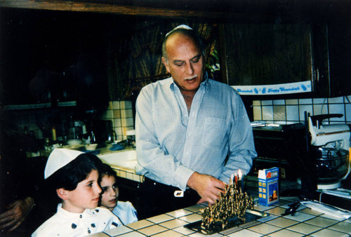 Lighting candles on Hanukkah